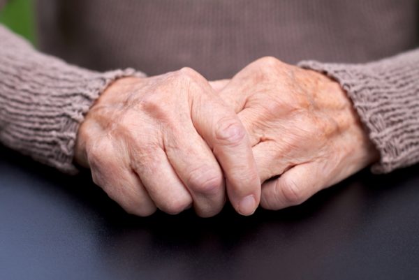 persons hands clasped