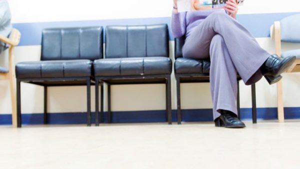 person waiting for doctor in waiting room