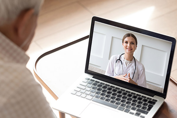 patient using laptop for virtual doctor appointment
